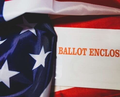 election anxiety: A presidential election ballot wrapped in the American flag.