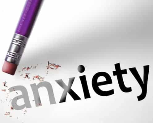 picture of the word Anxiety being erased with a purple pencil.