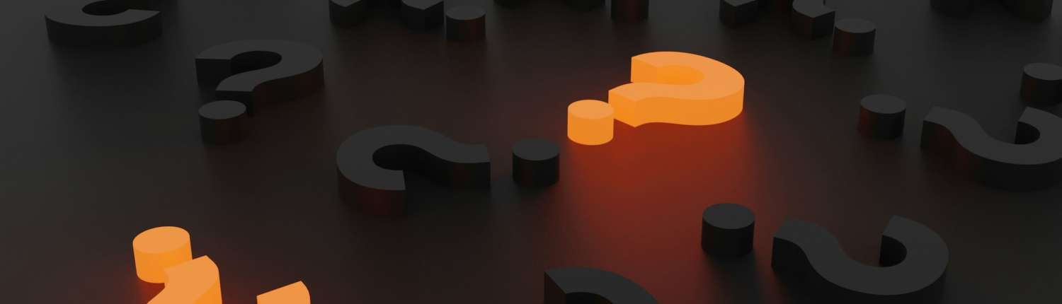 Question marks scattered across a black desktop. Two are lit up orange.